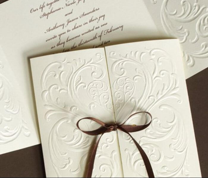 embossed white paper wedding invitations