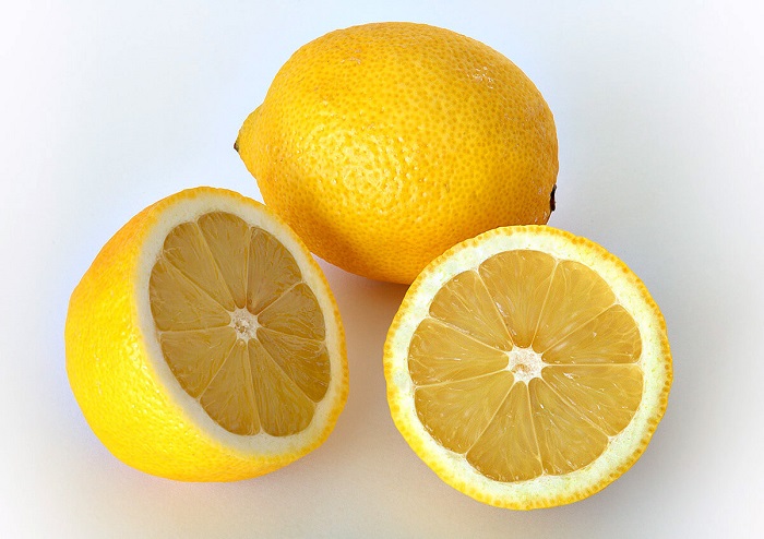 whole and halved lemons